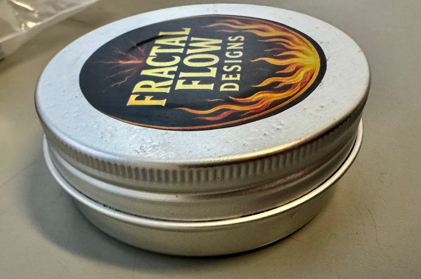 Natural wood and resin board wax in metal tin with flame logo – made in Victoria, Australia