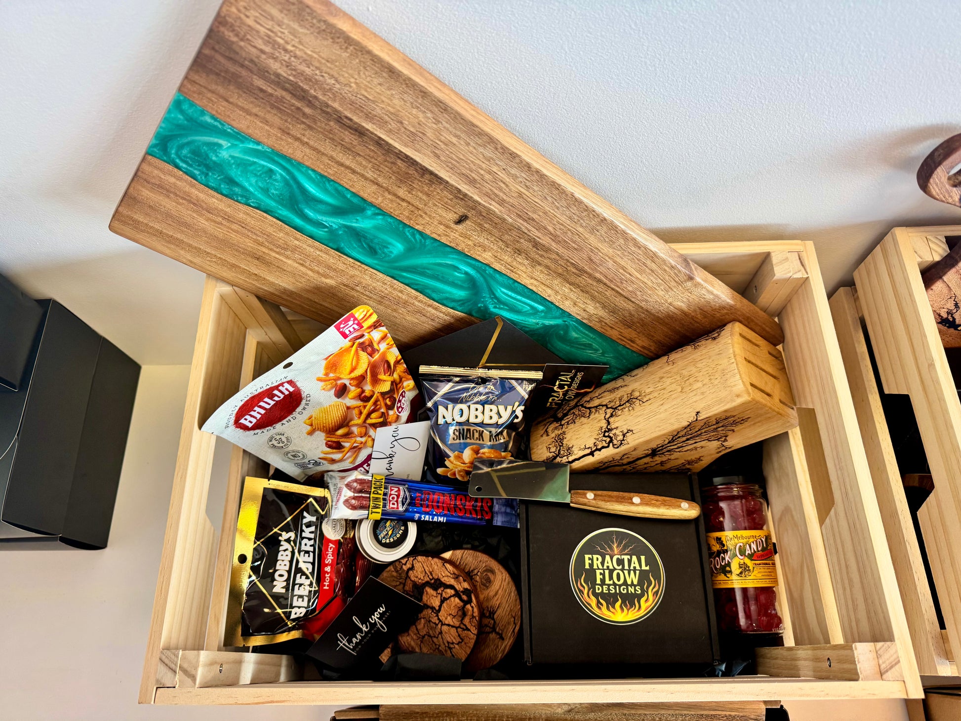 Premium resin board gift box in wooden crate with gourmet snacks and accessories – made in Victoria, Australia
