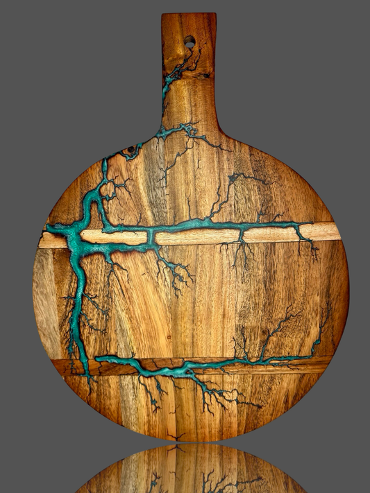 Elegant round paddle board by Fractal Flow Designs – made in Bairnsdale from Australian hardwood. A standout piece for resin board fans, gifting, and BBQ entertainers.